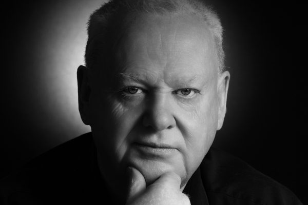 black and white portrait of a mature man looking at the camera