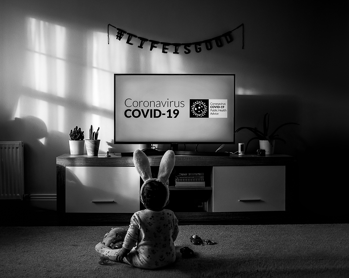 Photographs of a small child looking at a Covid-19 TV announcement in 2020, by Camila Lee, Chairperson's Award 2022